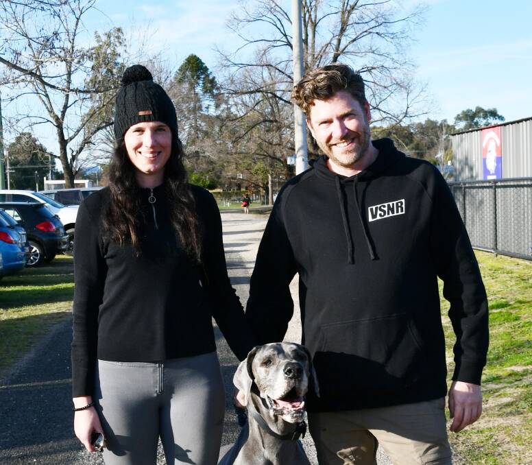 BRAVING THE COLD: Tanae Holland and Steve Stewart take their dog Leo for a walk around Jindera.