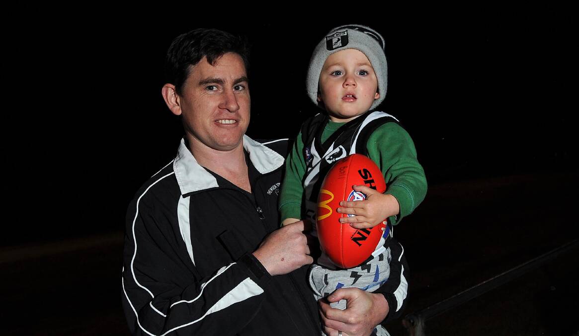 DAD'S BIG DAY: The Rock-Yerong Creek stalwart Bryan Ball with son Huxton, 2, at training this week. Picture: Laura Hardwick