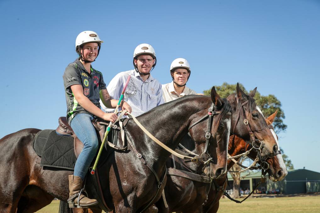LET'S RIDE: Maya Scott, 13, Jimmy Grills and Thomas Wilms, 14, warm up for this week's polocrosse carnival in Albury. Picture: JAMES WILTSHIRE