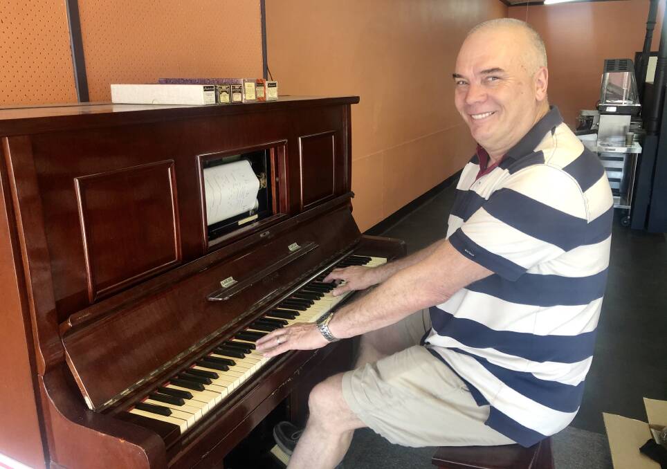 Steve Peters with the pianola that is set to become a feature of the new bakery. The bakery will open seven days a week.