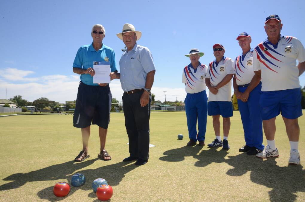 WELCOME GRANT: Member for Wagga Daryl Maguire presents Barry Love, Stuart Carn David Flynn, Keith Bender and Steve Johnston with a $5000 grant for the bowling club.