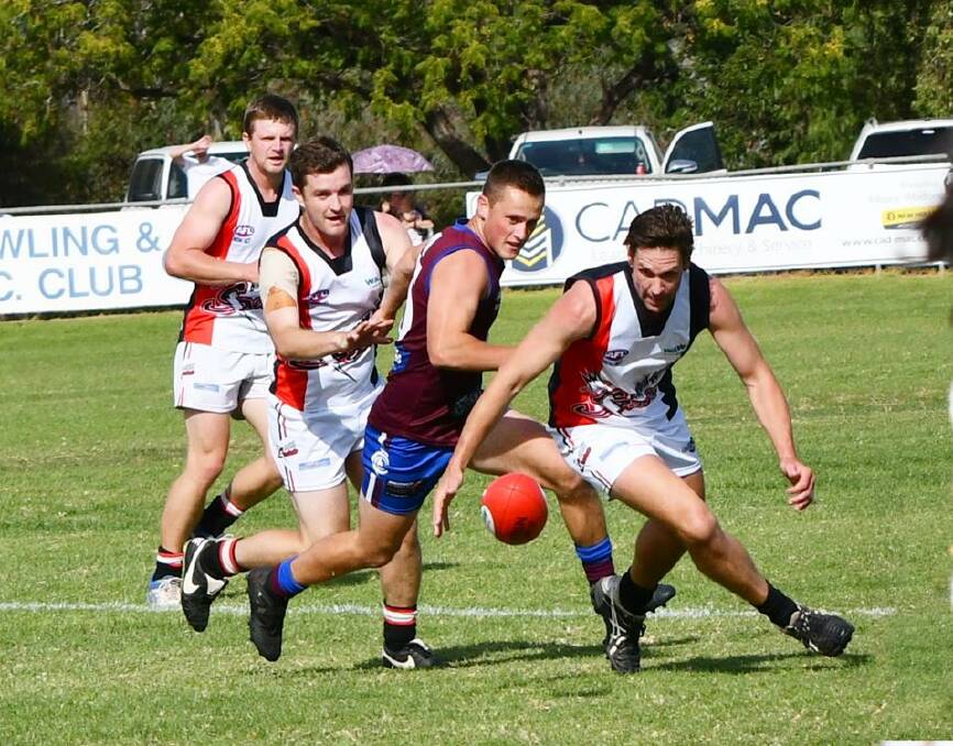 CULCAIRN'S DAY: Ben Gould, Culcairn, and Jarod Koschitzke, Brock Burrum Saints, tussle for the ball during the Lions' win at the weekend. Picture: Lorri Roden