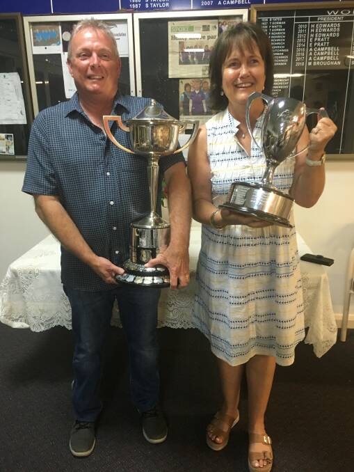CHAMPIONS: Men's champion, Glen Harrison, and women's champion, Jane Yates, with their silver ware after the presentation. Picture: Contributed