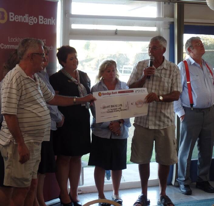 THANKS: Lockhart Bowling Club president Barry Love and secretary-treasurer Peter Hannon receive a grant from representatives of Bendigo Bank, Lockhart. 