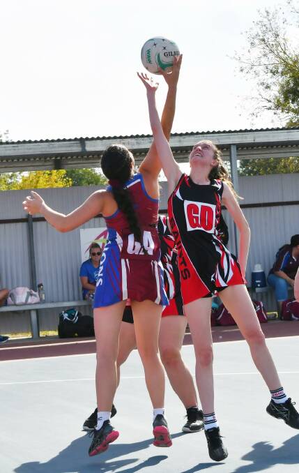 ON THE COURTS: Caylah Roberts, Culcairn, and Mikayla Jones, Brock Burrum Saints, during one of the Hume League Netball Association games. Picture: Lorri Roden