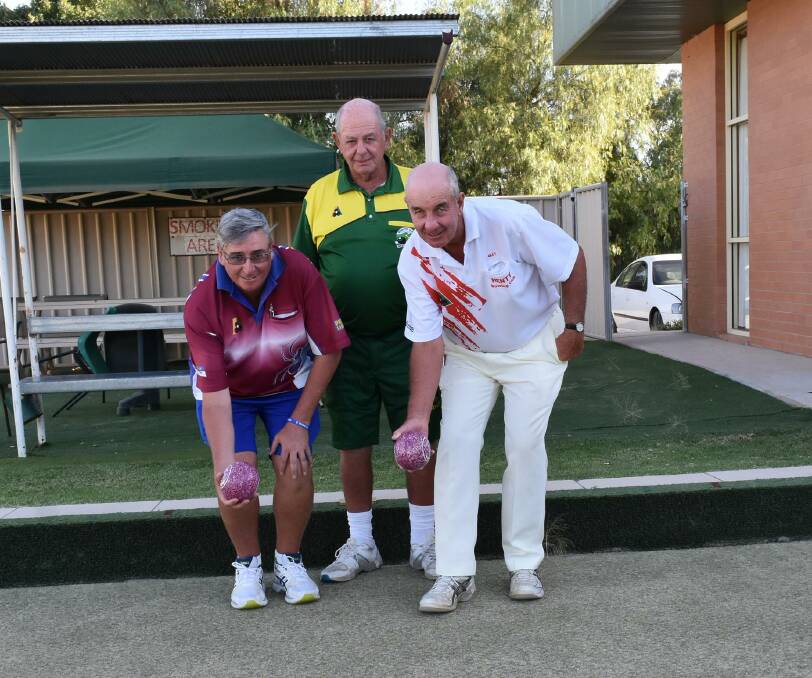 BOWLED OVER: Joe Gibson, Narrandera, Alan Monfries (former Australian singles champion) and Peter Forck, Henty. Picture: Lorri Roden