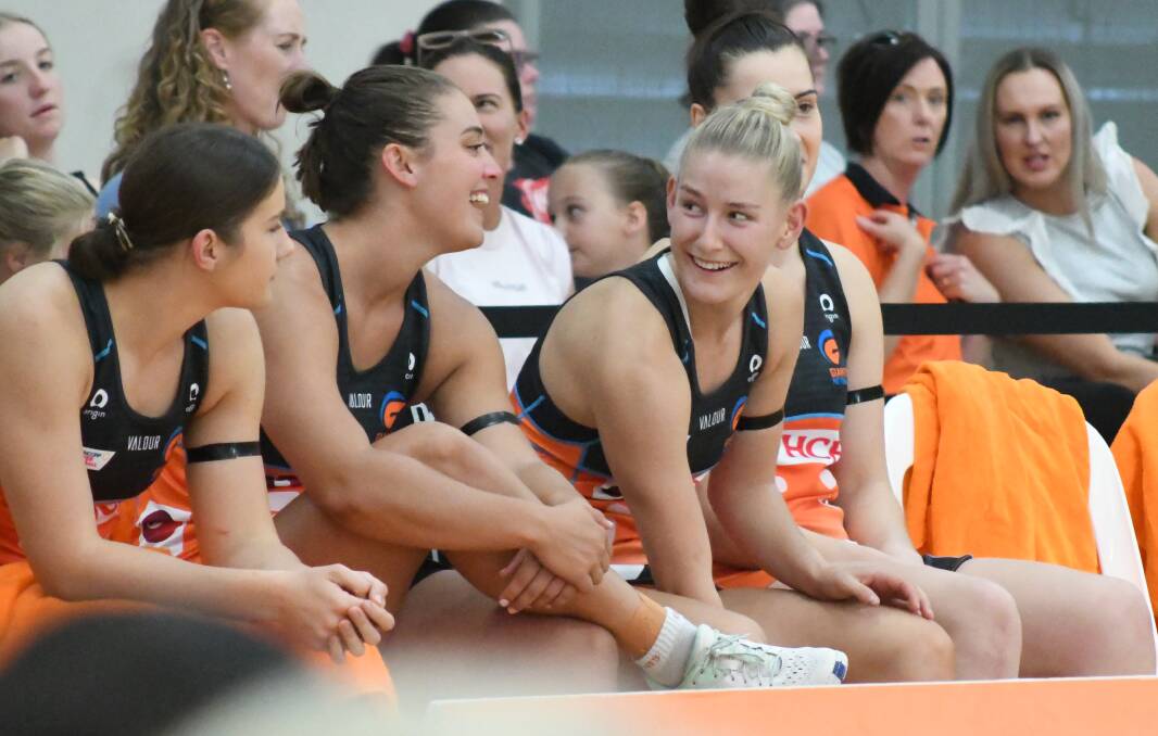 DELIGHTED: Annie Miller on the bench for Giants Netball just before making her debut in front of her home crowd. Photo: JUDE KEOGH.