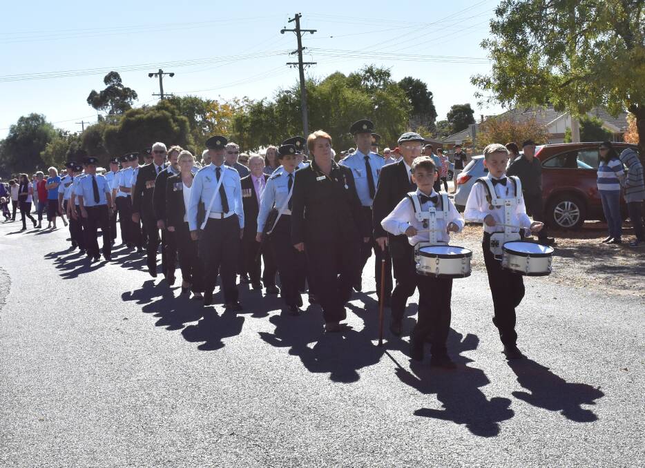 IN HONOUR: Henty will host the annual march to Memorial Park. In 2016 Henty's Ex Service Personnel were led by Henty RSL President Louisa Holyoake. 