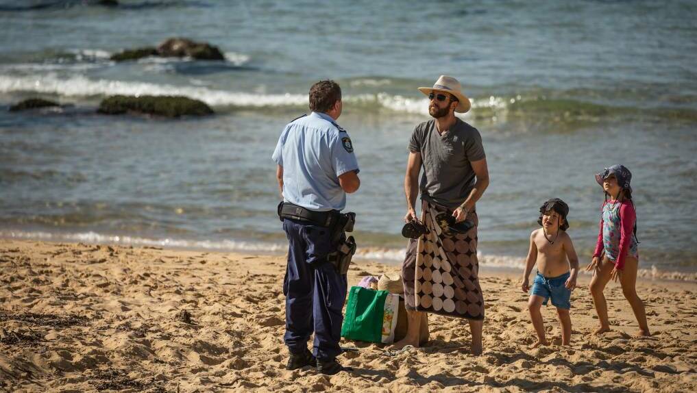 Say what? Police were on the beaches to enforce social distancing rules in Newcastle. Fines are yet to be issued in the city.