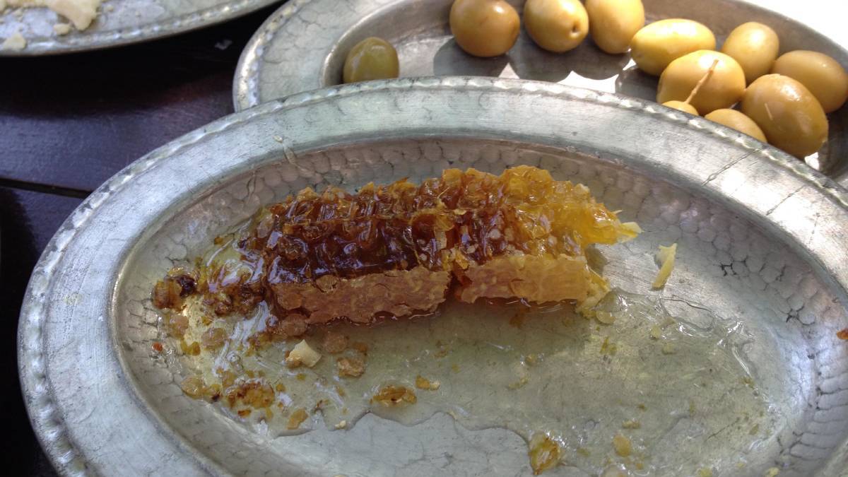 Fresh honeycomb and olives for breakfast. Fresh honeycomb and olives for breakfast.