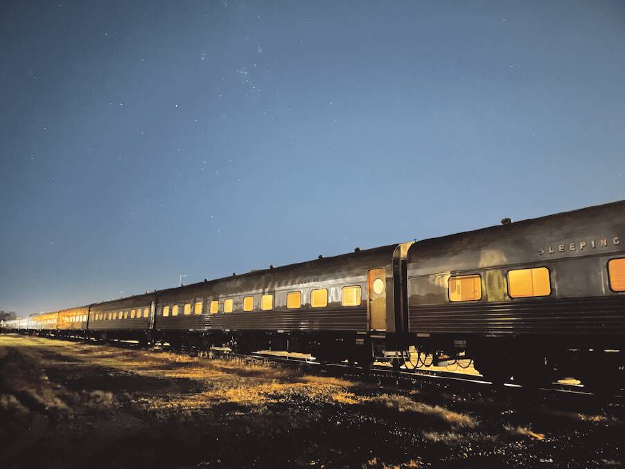 The train goes by beneath the stars The train goes by beneath the stars