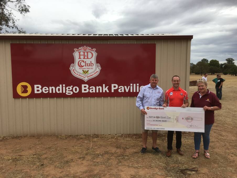 HOME: A new cricket pavilion has been opened at Paech Oval in Henty after the town's Bendigo Bank branch donated $10,000 towards the cost. Pictured are Dennis Kane, Mark White and Sharon Gardiner. Picture: SUPPLIED