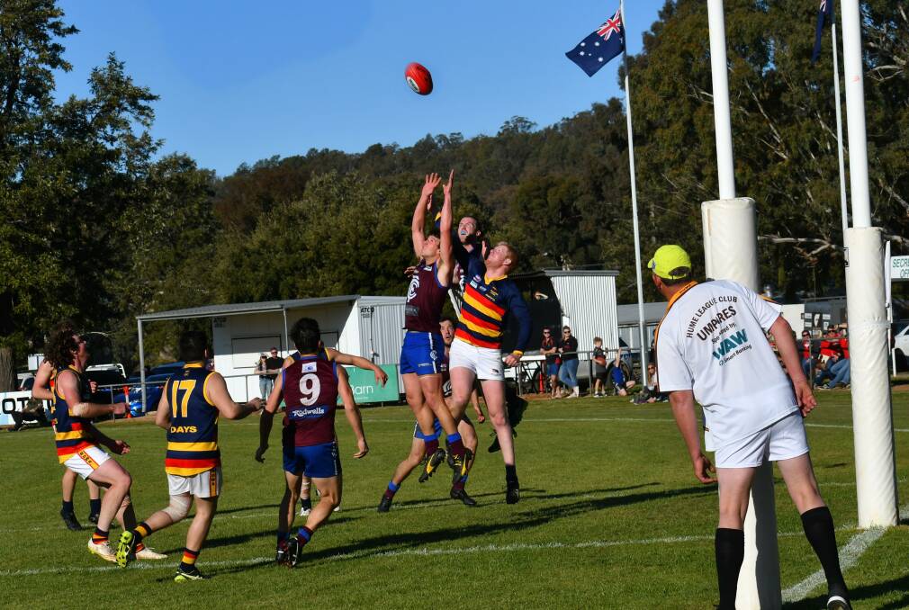 AIR BATTLE: The big men fly during Saturday's exciting Hume Football League elimination final between Culcairn Lions and the Billabong Crows. Picture: LORRI RODEN
