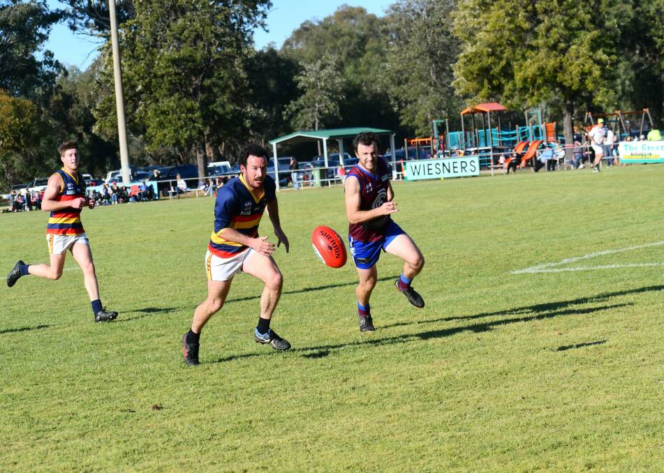 CONTEST: Billabong Crows' Harry Stonell and Culcairn's Nat Stroh make a line for the ball during their elimination final clash on Saturday. Picture: LORRI RODEN