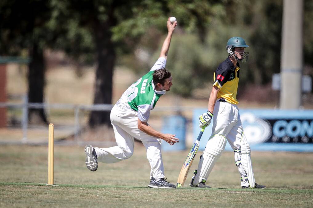 TIGHT CONTEST: Walla's Tom Simmons prepares to send one down against Walbundrie. The Tigers ended up triumphing by 10 runs, booking a spot in the grand final in exciting fashion. Picture: James Wiltshire