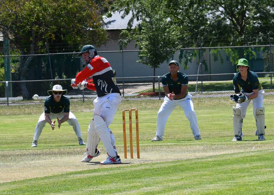 SWINGING: Brock Burrum batsman Trent I'Anson looks to play a shot as Holbrook's Hamish Mackinlay, Robbie Mackinlay and Terry Herriot watch on. Picture: LORRI RODEN