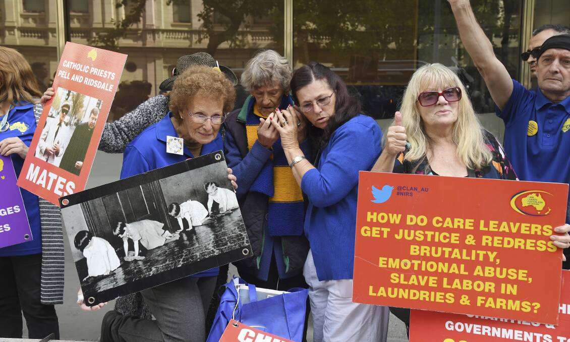 Survivors: Adults sexually abused while in church-run homes stand outside a Melbourne Court today for the Pell sentencing.