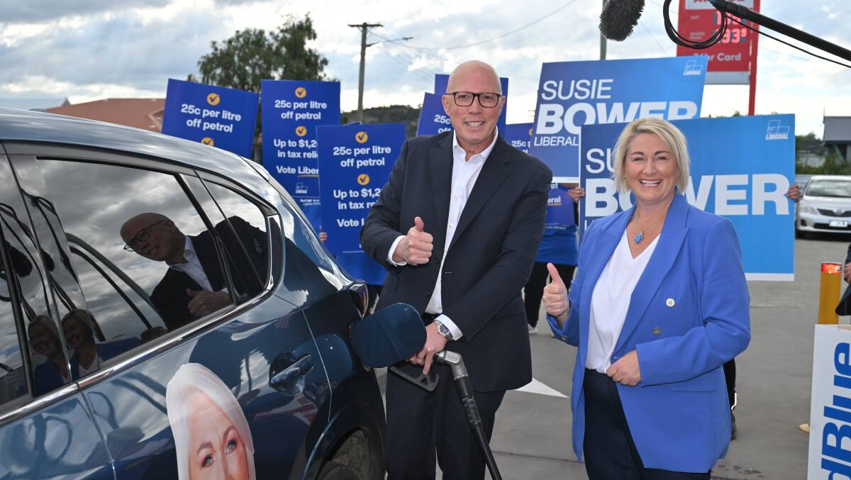 Peter Dutton with Liberal candidate for Lyons Susie Bower. Picture AAP