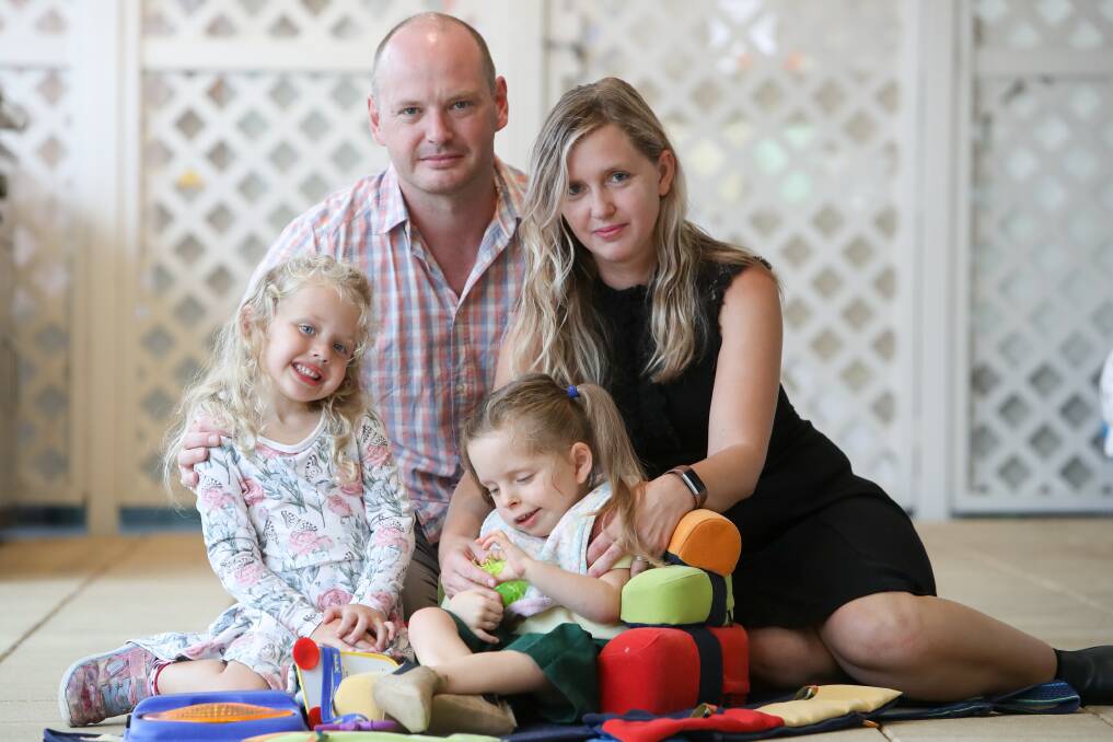 Blaise and Rob Hall with Eleanor, 6 and Beatrix, 4. The couple is appealing cuts to the NDIS package for Eleanor. Picture: Adam McLean