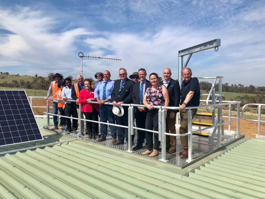NEW SUPPLY: Riverina Water County Council with a number of Wagga city councillors atop the reservoir at South Kapooka. Picture: Toby Vue
