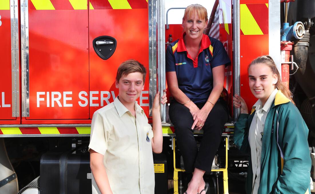 FAMILY EFFORT: The Rock's firefighter Petrina O'Connor (centre) with her childre — Aaron, 12, and Georgia, 15. Picture: Emma Hillier