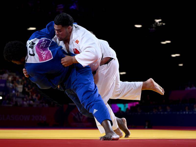 Paula Monta of Tonga slams his Canadian opponent in the +100kg bronze medal match in Glasgow. Photo: Joel Carrett/AAP PHOTOS Paula Monta of Tonga slams his Canadian opponent in the +100kg bronze medal match in Glasgow. Photo: Joel Carrett/AAP PHOTOS