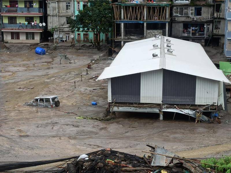 India's Sikkim state was plunged into chaos as floods spurred by rain killed at least 18 people. (AP PHOTO)