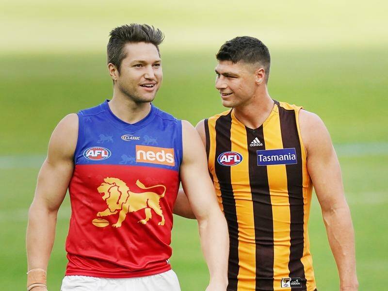 Stef Martin (l) has recovered from knee injury to return to action for the Lions in AFL's round two.