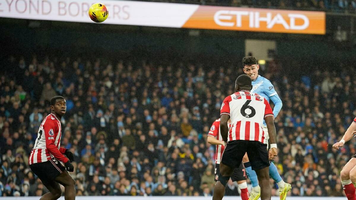 Manchester City's Phil Foden heads home a third in their easy win over Sunderland. (AP PHOTO) Manchester City's Phil Foden heads home a third in their easy win over Sunderland. (AP PHOTO)
