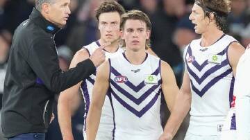 Justin Longmuir (l) is backing Nat Fyfe (r) and the rest of the midfielders to improve against Port.