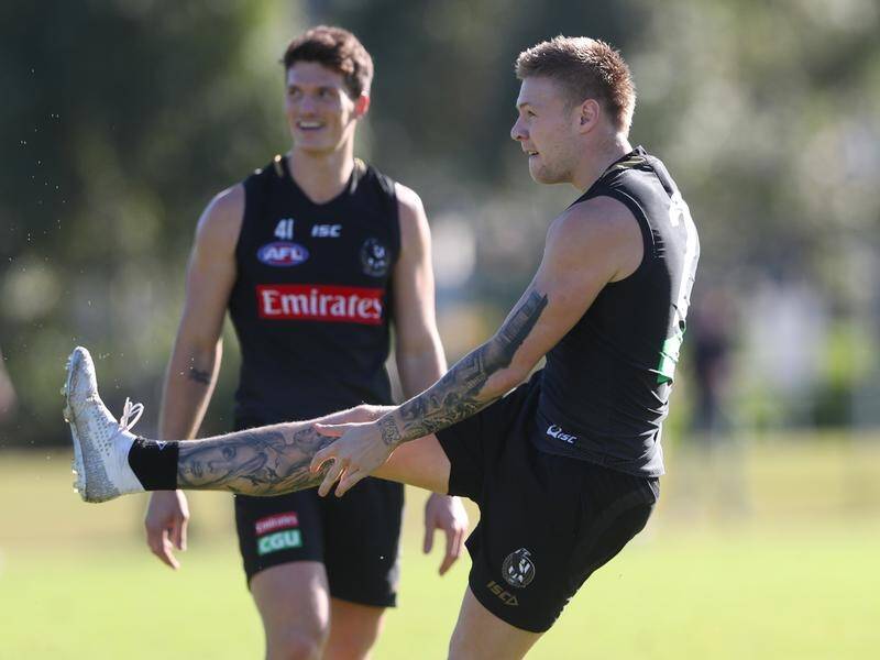 Jordan De Goey (r) will return for Collingwood this week after missing the win over the Saints.
