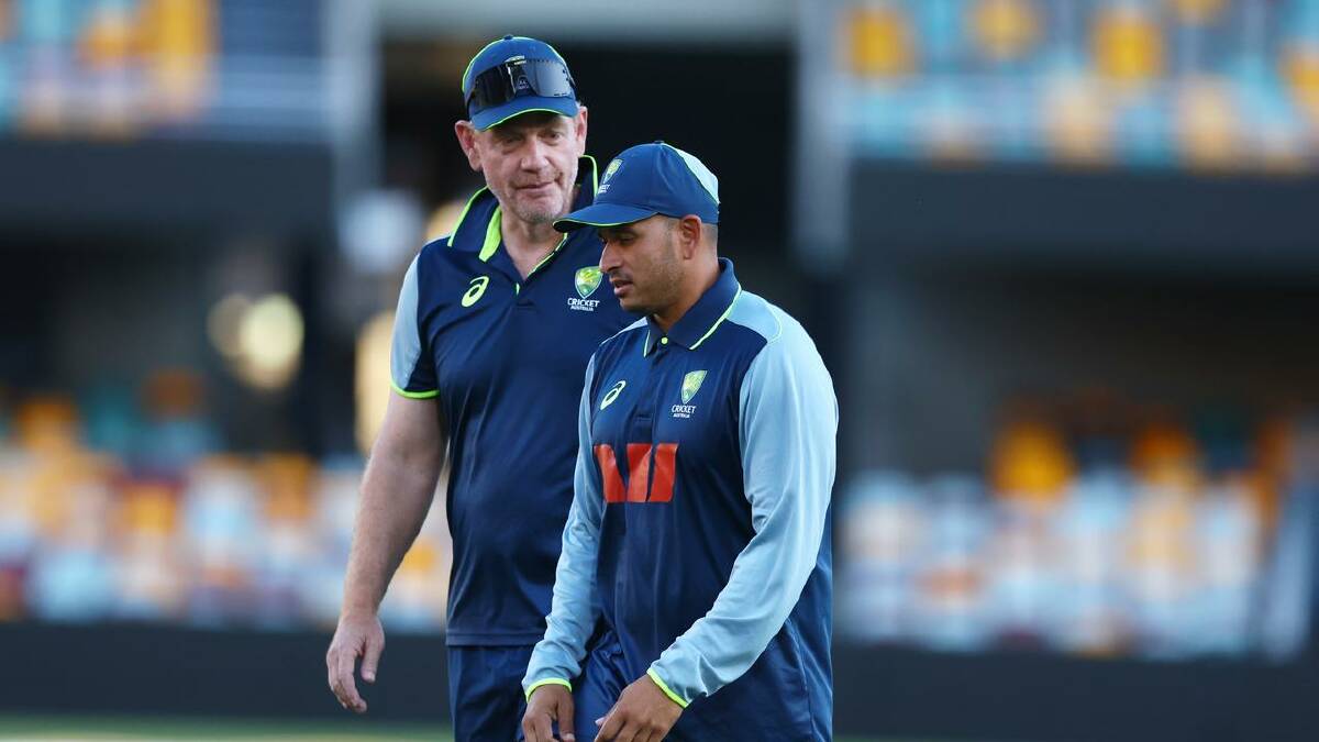 Khawaja (R) with coach Andrew McDonald at training after being ruled out of the second Test. (AAP PHOTOS) Khawaja (R) with coach Andrew McDonald at training after being ruled out of the second Test. (AAP PHOTOS)