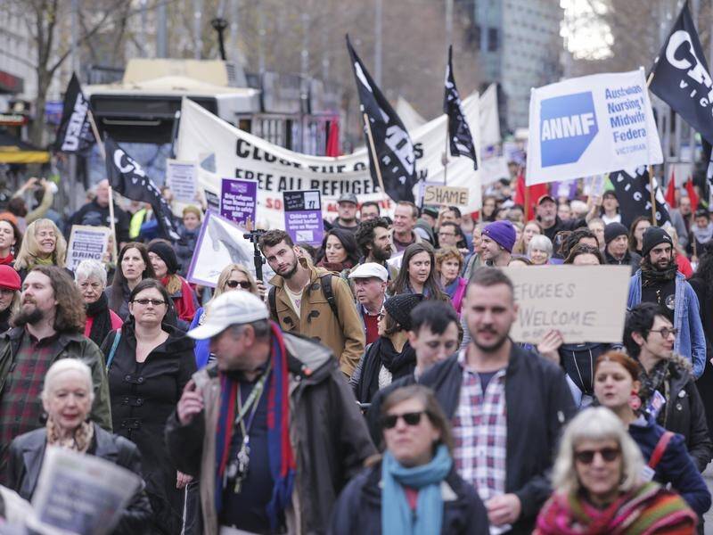 Thousands of people rallied in Melbourne demanding refugees be brought to Australia immediately.