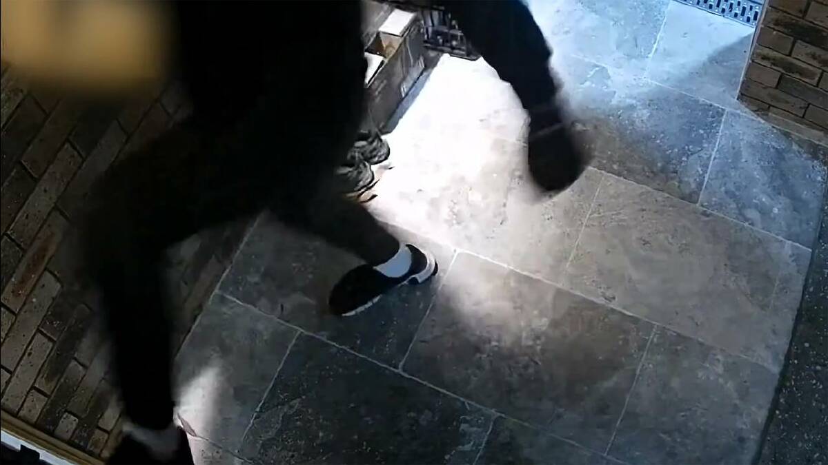 Police released footage of a man attempting to kick open the door of a home in Sydney's southwest. (HANDOUT/NSW POLICE) Police released footage of a man attempting to kick open the door of a home in Sydney's southwest. (HANDOUT/NSW POLICE)