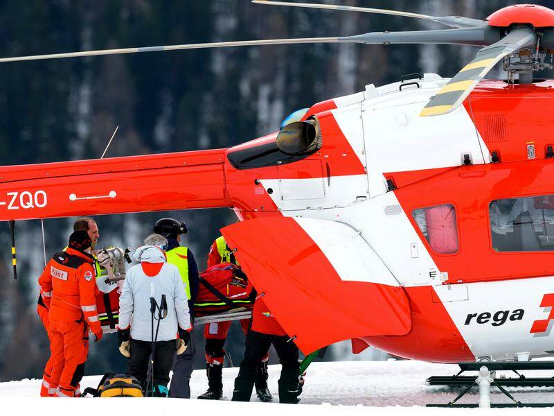 Swiss ski star Michelle Gisin is lifted into a helicopter after crashing in training at St Moritz. Photo: AP PHOTO Swiss ski star Michelle Gisin is lifted into a helicopter after crashing in training at St Moritz. Photo: AP PHOTO