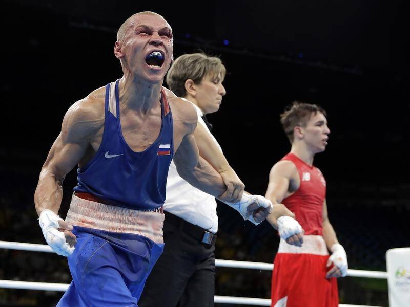 Russian boxers like Vladimir Nikitin (L) may boycott the Tokyo Olympics over WADA sanctions
