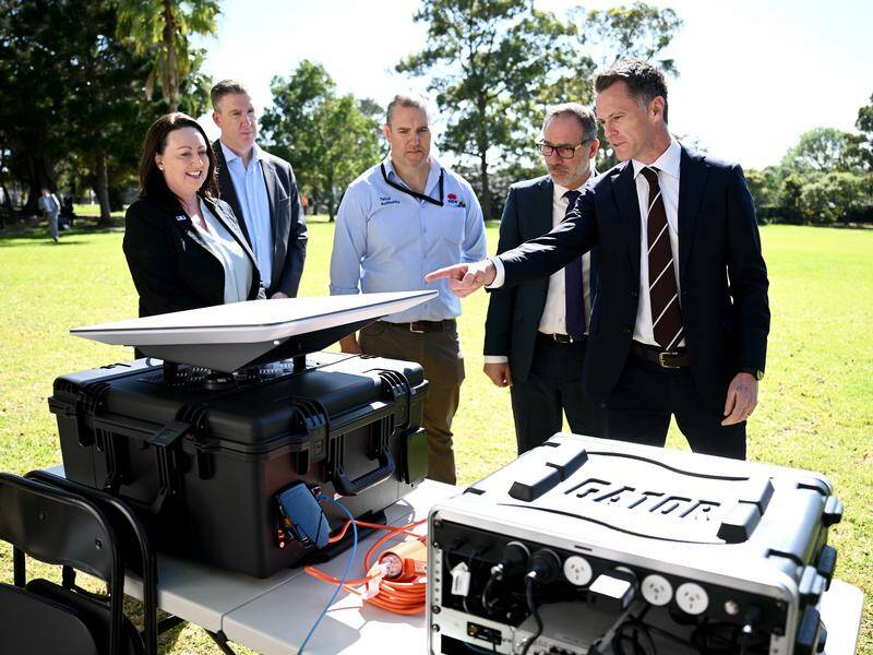 Premier Chris Minns and Emergency Services Minister Jihad Dib inspect new mobile connectivity units. Photo: Bianca De Marchi/AAP PHOTOS