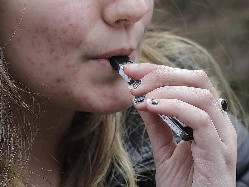 Doctors say vaping products are "very clearly" being targeted towards non-smokers. (AP PHOTO)