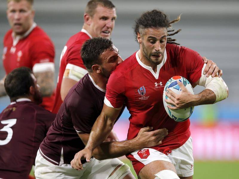 Wales' Josh Navidi runs at the Georgia defence during his side's comfortable Rugby World Cup win.