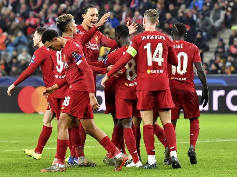 Holders Liverpool have advanced to the Champions League last 16 as group winners.