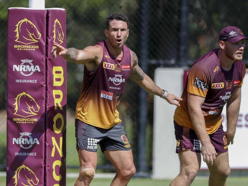 Anthony Seibold has backed embattled Brisbane captain Darius Boyd (L) to recover his best form.