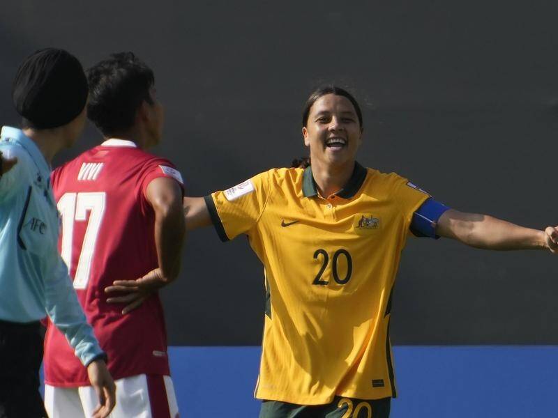 Sam Kerr celebrates one of her five goals on her record-breaking night against Indonesia.