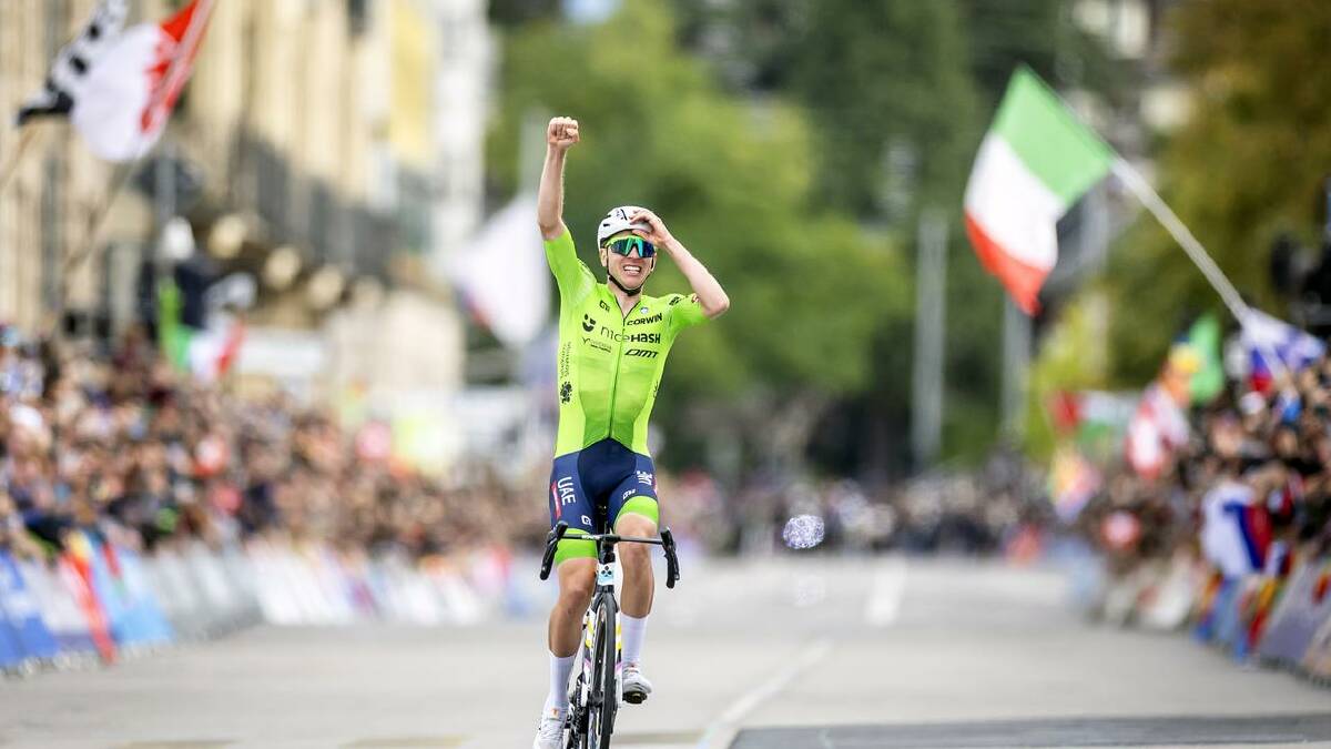 Tadej Pogacar, of Slovenia, celebrates winning the road race world championship in Switzerland. (EPA PHOTO)
