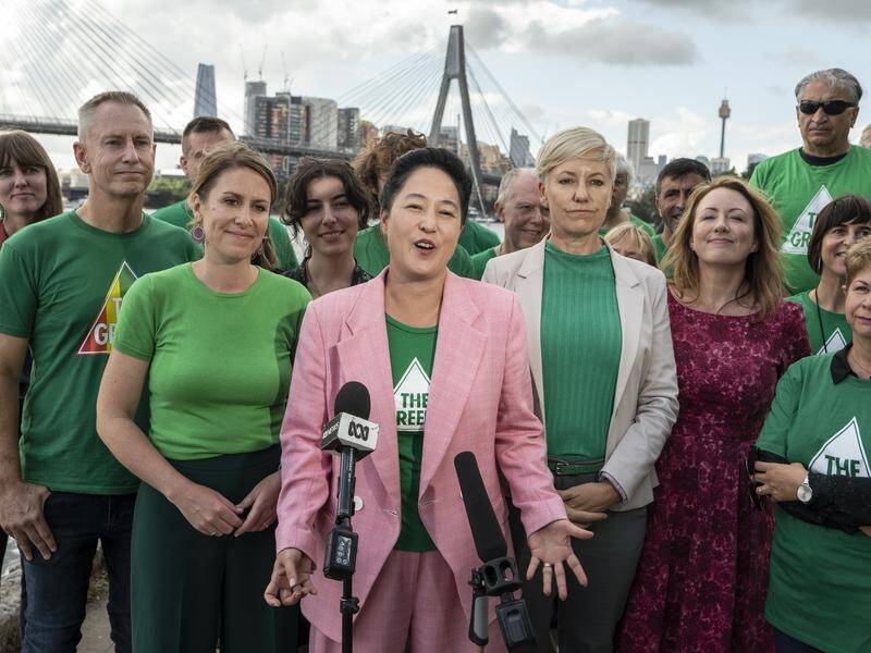 Newtown MP Jenny Leong (C) says the Greens want the coalition out but also aren't happy with Labor. (Flavio Brancaleone/AAP PHOTOS)