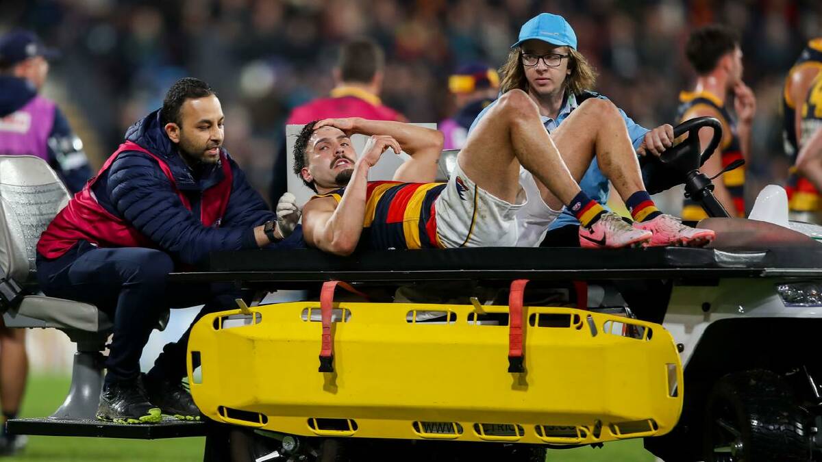 Izak Rankine was taken off the field after clashing with the Power's Dan Houston. (Matt Turner/AAP PHOTOS) Izak Rankine was taken off the field after clashing with the Power's Dan Houston. (Matt Turner/AAP PHOTOS)