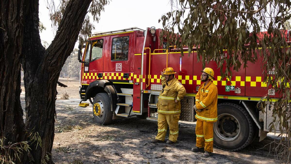 Firefighters are exhausted after protecting properties and trying to bring the blaze under control. (Diego Fedele/AAP PHOTOS) Firefighters are exhausted after protecting properties and trying to bring the blaze under control. (Diego Fedele/AAP PHOTOS)