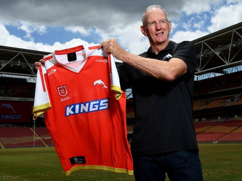 Dolphins coach Wayne Bennett holds the heritage jersey the newest NRL club will wear in 2023.