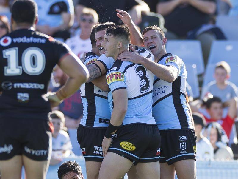 Cronulla have scored a vital 42-16 win over the Warriors to maintain their NRL top-eight hopes.