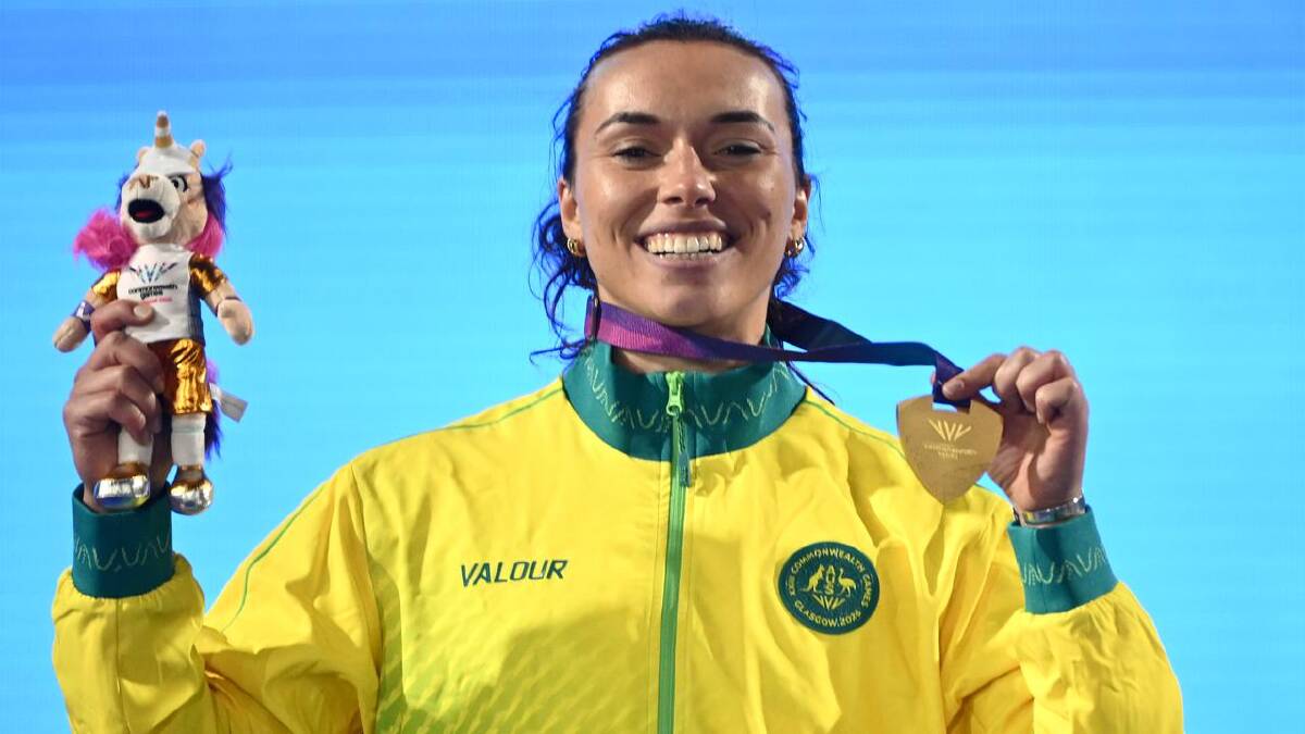 Straight back to work for javelin champion and doctor Mackenzie Little. (Joel Carrett/AAP PHOTOS) Straight back to work for javelin champion and doctor Mackenzie Little. (Joel Carrett/AAP PHOTOS)