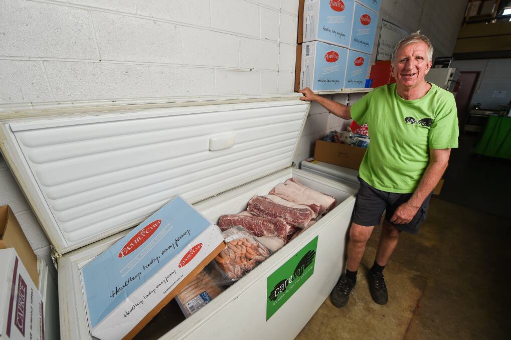 ABOVE: Carevan director Dave Gleeson, pictured with piles of donated frozen pork, says the charity is based on generosity. Picture: MARK JESSER